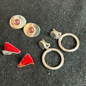 3 pairs of silver earrings. (One set is clip-on)